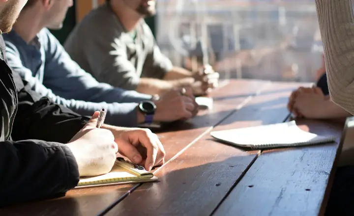 Business owners planning around a table